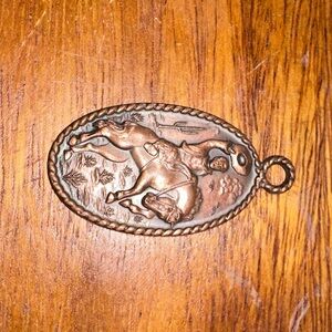 Solid copper cowboy & bucking horse pendant